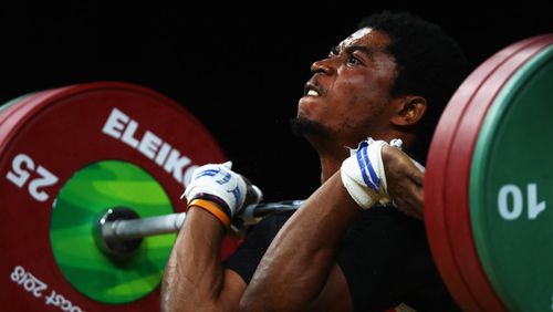  Olivier Heracles Matam Matam of Cameroon competes during the weightlifting men's 62kg final. (Getty)