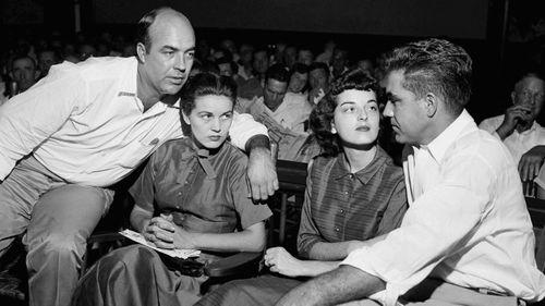 J.W. Milam, left, his wife, second left, Roy Bryant, far right, and his wife, Carolyn Bryant, sit together in a courtroom in Sumner, Miss. Bryant and his half-brother Milam were charged with murder but acquitted in the kidnap-torture slaying of 14-year-old black teen Emmett Till in 1955. (AP)