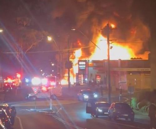 Massive fire erupts at Campbelltown petrol station after reports of explosions