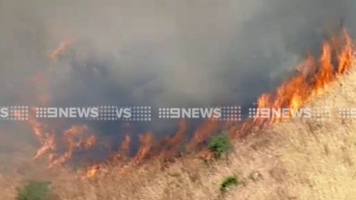 Twenty fire crews were earlier battling the fire. (9NEWS)