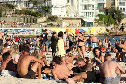 Beachgoers are seen at Bondi Beach despite the threat of Coronavirus (COVID-19) in Sydney, Friday, March 20, 2020.