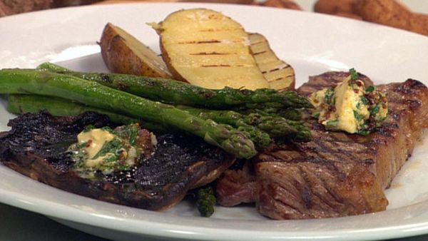 Steak dinner with grilled potato, mushroom and asparagus