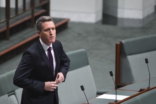  Labor MP Josh Wilson reacts as Australian Treasurer Scott Morrison introduces the Personal Income Tax Bill today. (AAP)
