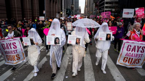 Activists from "Gays Against Guns" join others as they take part in the New York Women's March. (AP)