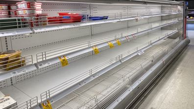 Empty supermarket shelves at Coles