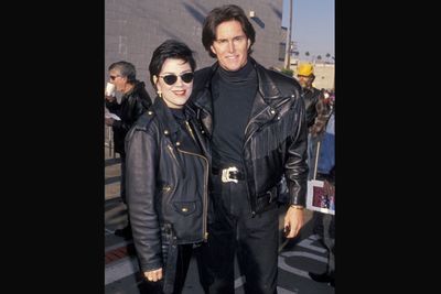 The couple can’t resist another biker moment during the Harley Davidson 'Love Ride 11' charity event in 1994.