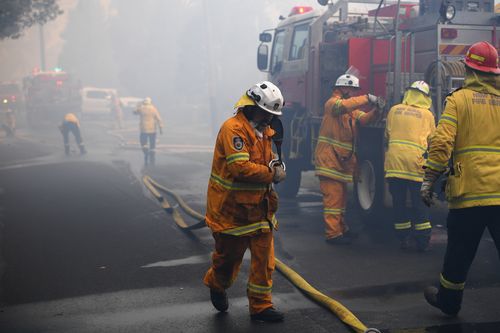 Hot, windy conditions are wreaking havoc as bushfires burn out of control across parts of NSW, with 14 current emergency warnings in the state. (AAP Image/Dan Himbrechts) NO ARCHIVING