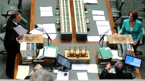 Tony Abbott and Julia Gillard face off in parliament. (AAP)