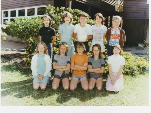 Jenny in a picture taken at school standing next to the musician Keith Urban, who is dressed in black (left).