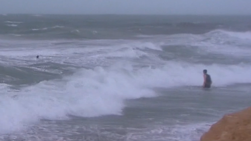 While rain is easing in WA, large swathes of coastline are being pounded by dangerous surf. 