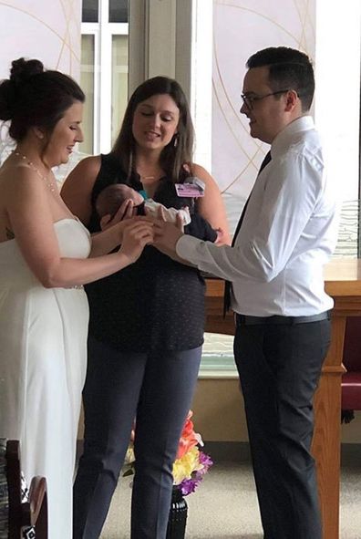 Bride carries premature baby down aisle at wedding