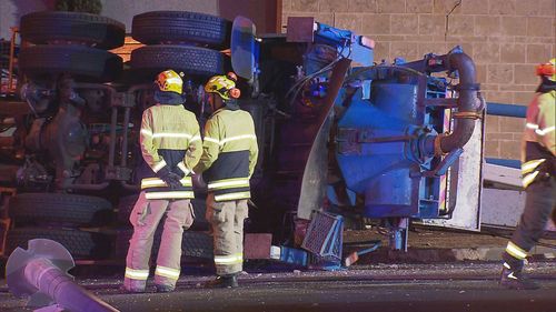 A driver has been taken to hospital in a serious condition after his truck rolled on the South Eastern Freeway in Adelaide.