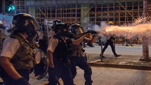 Police fire tear gas to disperse protesters attending an anti-government rally 