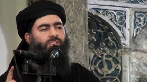 The leader of the Islamic State group, Abu Bakr al-Baghdadi, purportedly delivering a sermon at a mosque in Iraq during his first public appearance. (AAP)