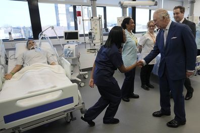 King Charles III speaks to students and trainees at the Intensive Care Ward as he visits the University of East London to mark the University's 125th anniversary and open a new frontline medical teaching hub in London, Wednesday, Feb. 8, 2023.