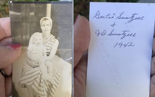 Woman holding photo blown away in tornado