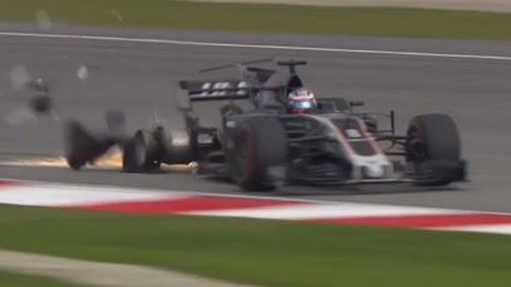 Malaysian Formula One Grand Prix: Romain Grosjean crashes in practice after loose drain punctures tyre