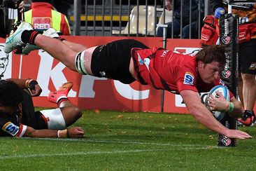 Cullen Grace of the Crusaders dives over to score a try during the round six Super Rugby Pacific match against the Chiefs.