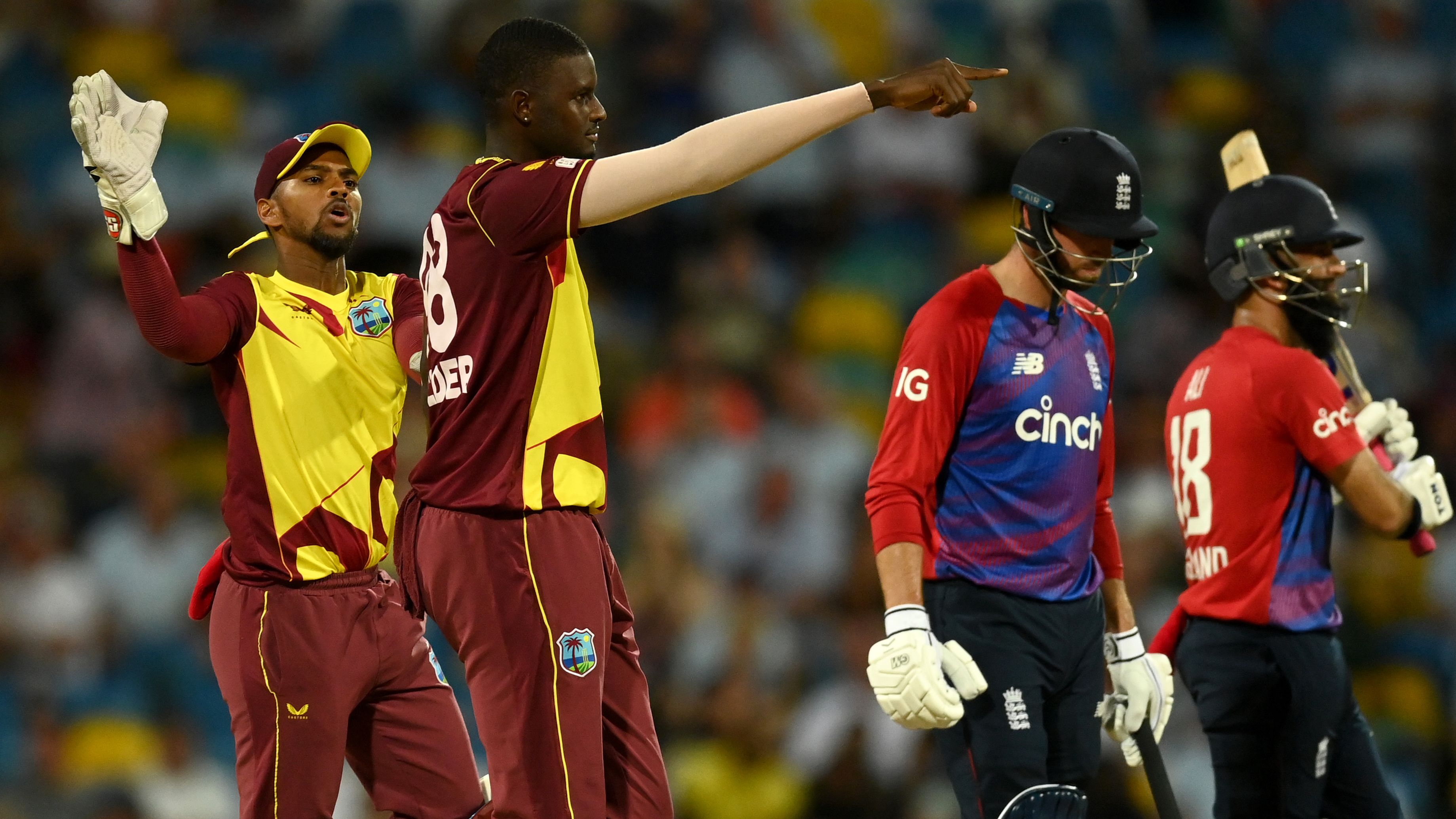Jason Holder of the West Indies celebrates dismissing England captain Moeen Ali.