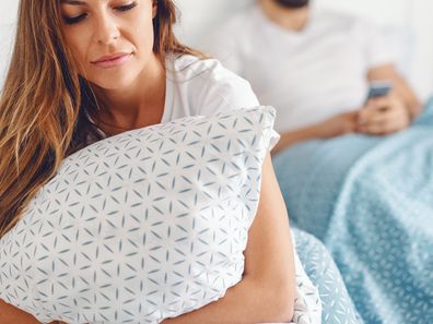 Woman and man in bed