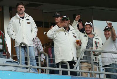 Souths owner Russell Crowe watches on.