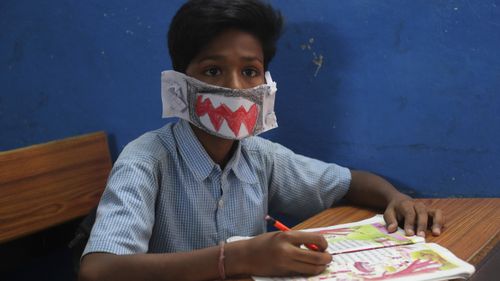 An Indian student in a handmade mask.