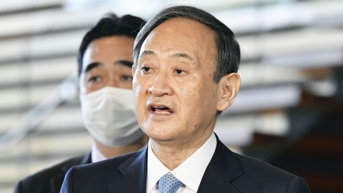 Japanese Prime Minister Yoshihide Suga speaks to the media after he held the telephone talk with US President-elect Joe Biden.