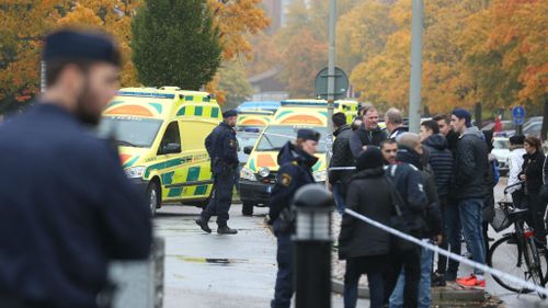 Swedish emergency services at the scene after a masked man attacked people with a sword at the Kronan school in Trollhaettan. (AAP)