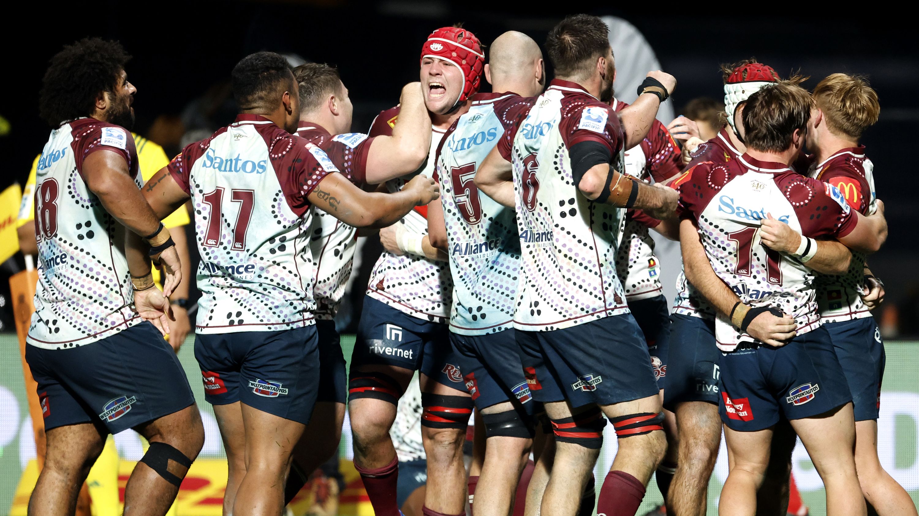 NEW PLYMOUTH, NEW ZEALAND - MAY 12: The Reds celebrate after winning the round 12 Super Rugby Pacific match between Chiefs and Queensland Reds at Yarrow Stadium, on May 12, 2023, in New Plymouth, New Zealand. (Photo by Andy Jackson/Getty Images)