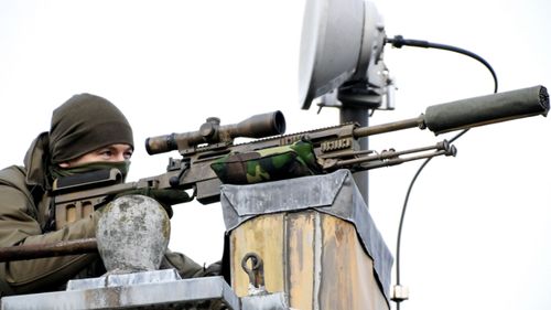 Heavy security including rooftop snipers watched over the signing ceremony.