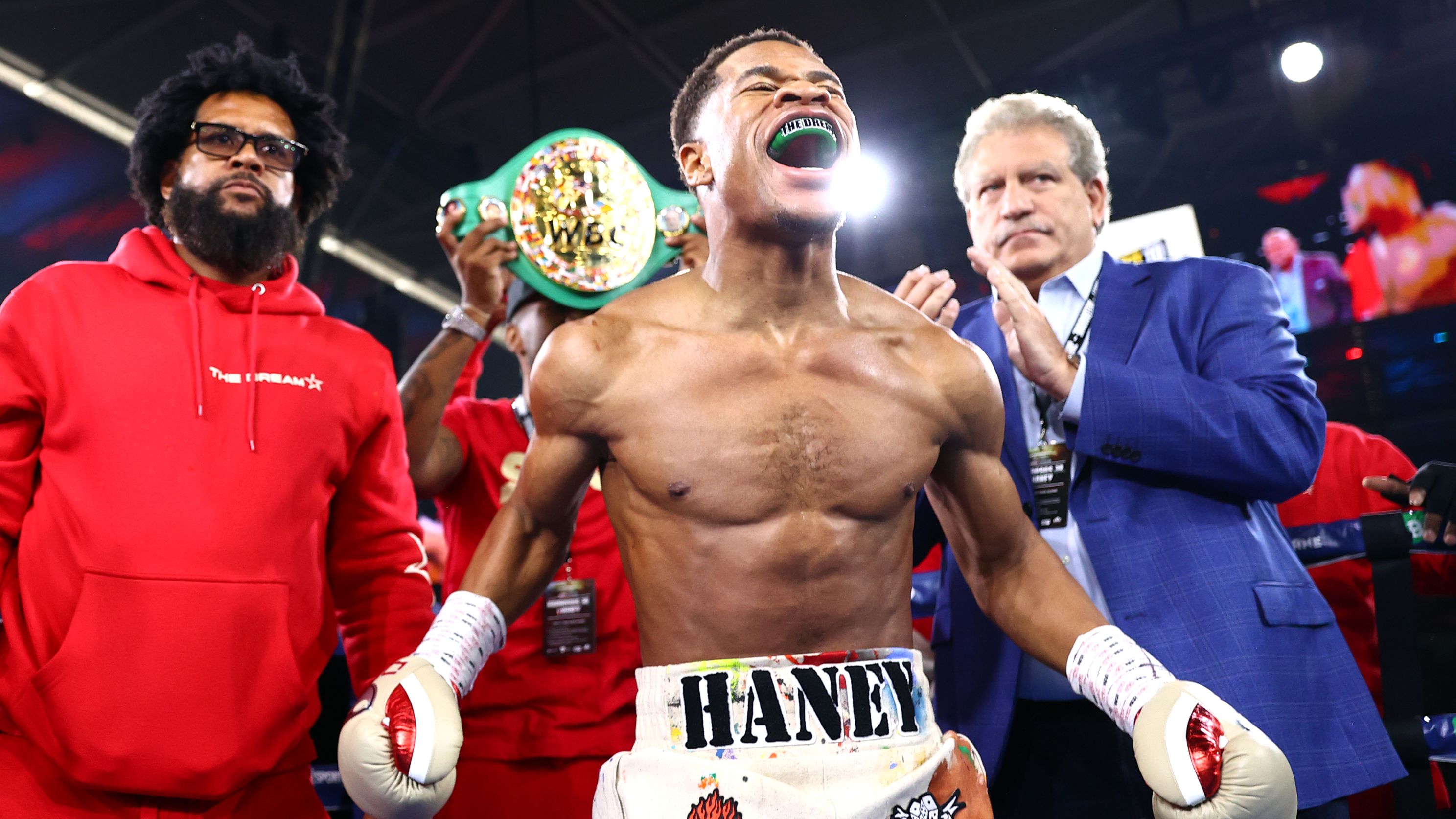 Devin Haney celebrates beating George Kambosos Jr in Melbourne.