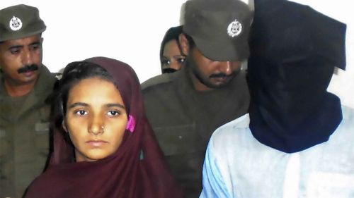 Asia Bibi and her boyfriend, Shahid Lashari, are presented to journalists, at police station in Muzaffargarh in Pakistan on October 30. (AAP)