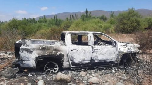 A burnt out ute in the search for the missing brothers.
