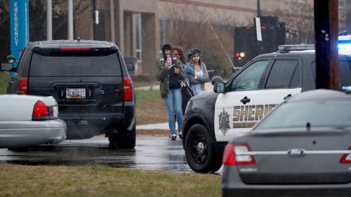 Students leave Great Mills High School following a shooting at the school in Maryland. (AAP)