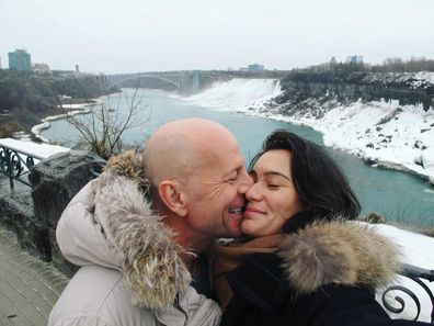 Bruce Willis and Emma Heming Willis share a kiss in a Valentine's Day snap.