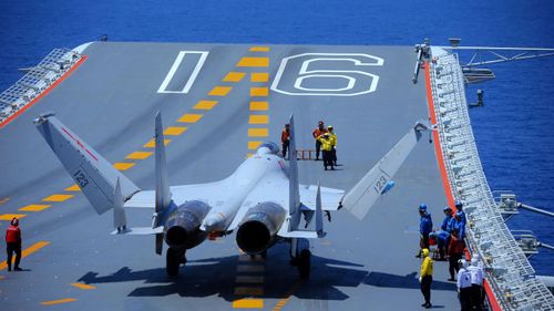 A fighter jet takes off from a Chinese aircraft carrier.