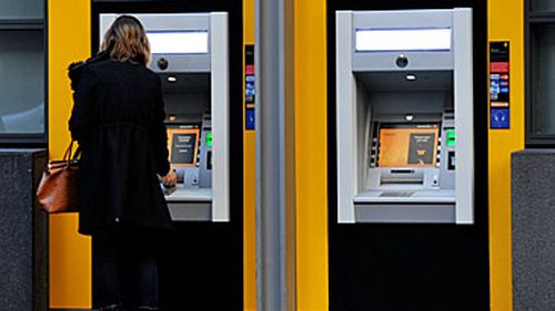 Woman at Commonwealth Bank ATM (AAP)