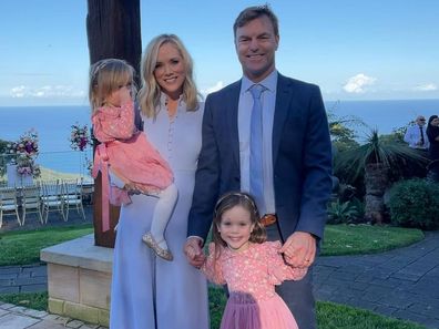 Sam Squiers with husband Ben and their two daughters, Imogen (right) and Elle (left).