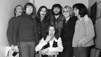 (L-R) Carl Radle, Bobby Keys, George Harrison, Delaney Bramlett, Bonnie Bramlett, Jim Gordon with Eric Clapton seated. Picture at Colston Hall, Bristol. December 1969
