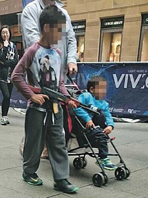 This photo of a boy carrying a toy gun in Martin Place has sparked debate.
