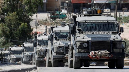 Military vehicles operate in the Israeli-occupied West Bank on June 10.