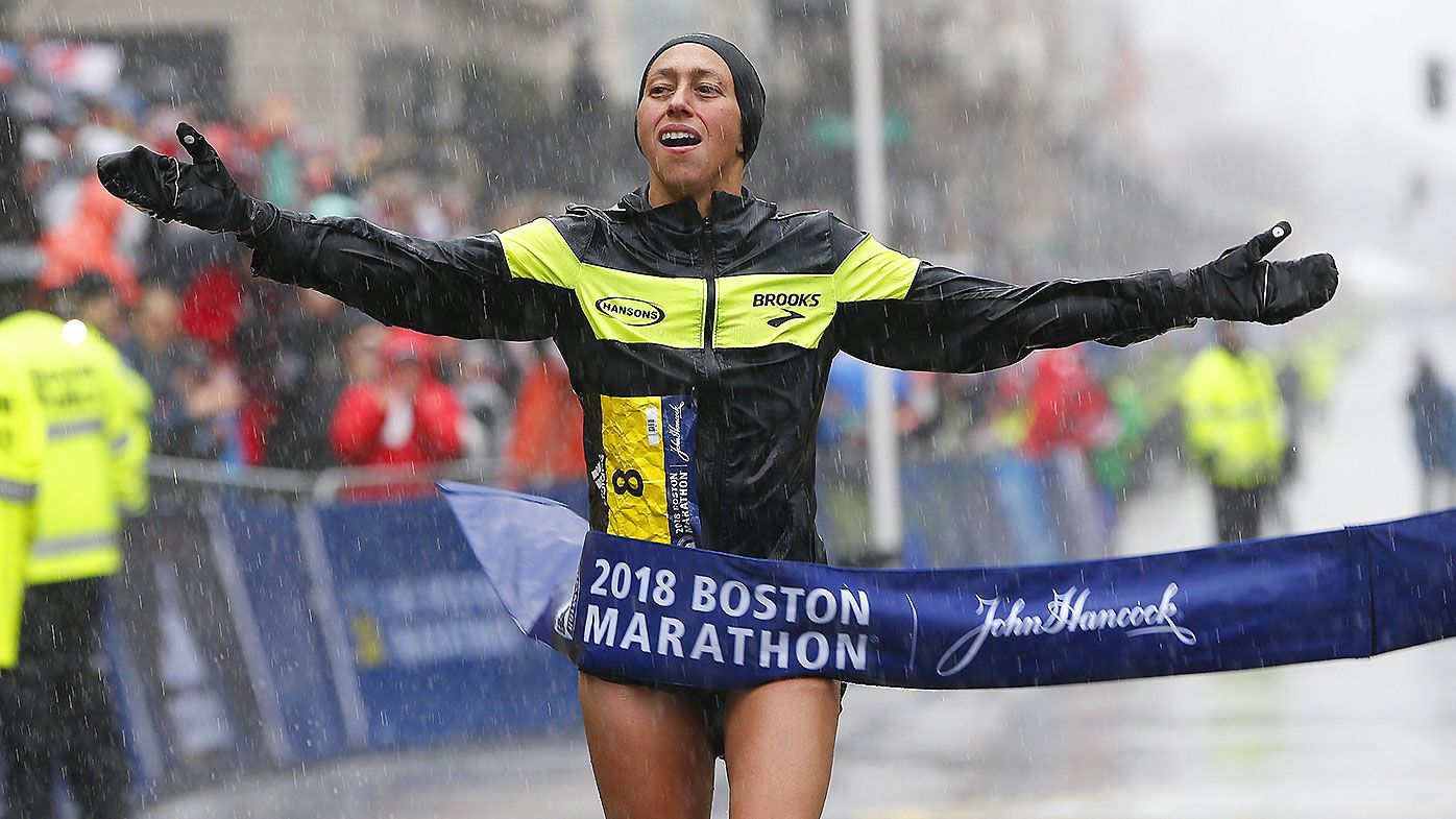 Desiree Linden of the US crosses the finish line to win the women's division of the 122nd Boston Marathon