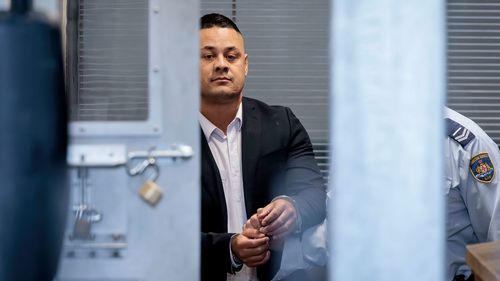 Jarryd Hayne is taken away after his bail was revoked on 14 April, 2023.