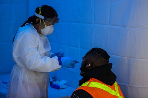 A man is seen getting a Covid-19 test at a Covid-19 testing hub in the Penn Station of New York, United States on December 30.