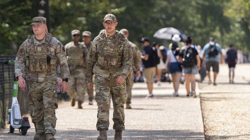 Members of the District of Columbia National Guard patrol along the National Mall.