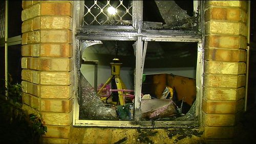 A child and pregnant woman who were sleeping inside the home at the time escaped unharmed. (9NEWS)