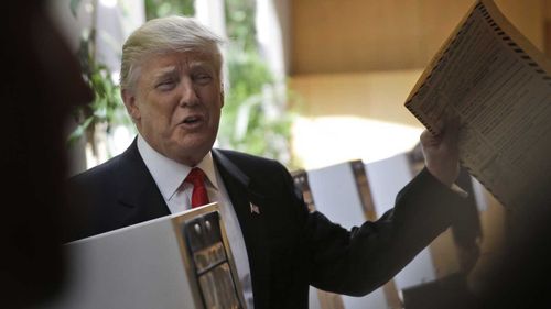 Donald Trump prepares to cast a ballot in the New York primary. (AAP)