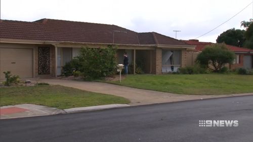 The car ploughed into the home this morning, before the driver set upon the couple inside. (9NEWS)