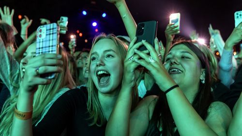 Concert goers attend in the  first COVID-19 restriction free event watch in Copenhagen, Denmark. 