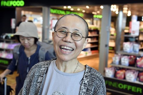 Liu Xia, the widow of Chinese Nobel dissident Liu Xiaobo, reacts as she arrives at the Helsinki International Airport in Vantaa, Finland, Tuesday, July 10, 2018. China on Tuesday allowed Liu Xia to fly to Berlin, ending an eight-year house arrest that had drawn intense international criticism and turned the 57-year old poet _ who reluctantly followed her husband into politics two decades ago _ into a tragic icon known around the world. (Jussi Nukari/ Lehtikuva via AP) 